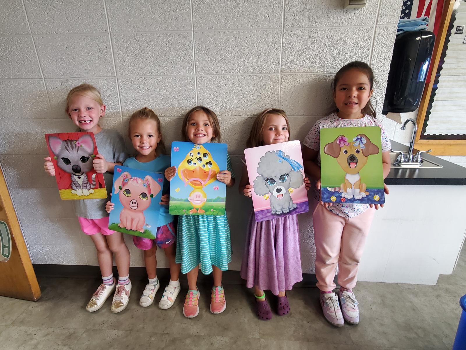 Students holding Art